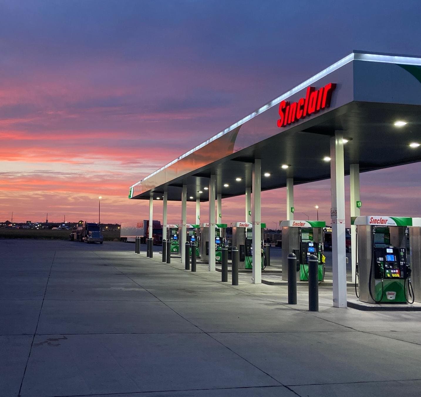Sinclair fuel pumps at sunset